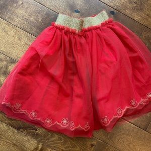 Mini Boden lined skirt with gold detailing.